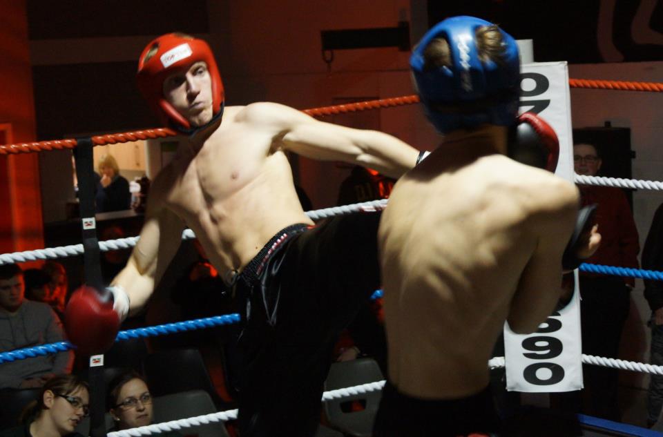 Craig Rainey throws a front leg roundhouse at Dayle Barnaby